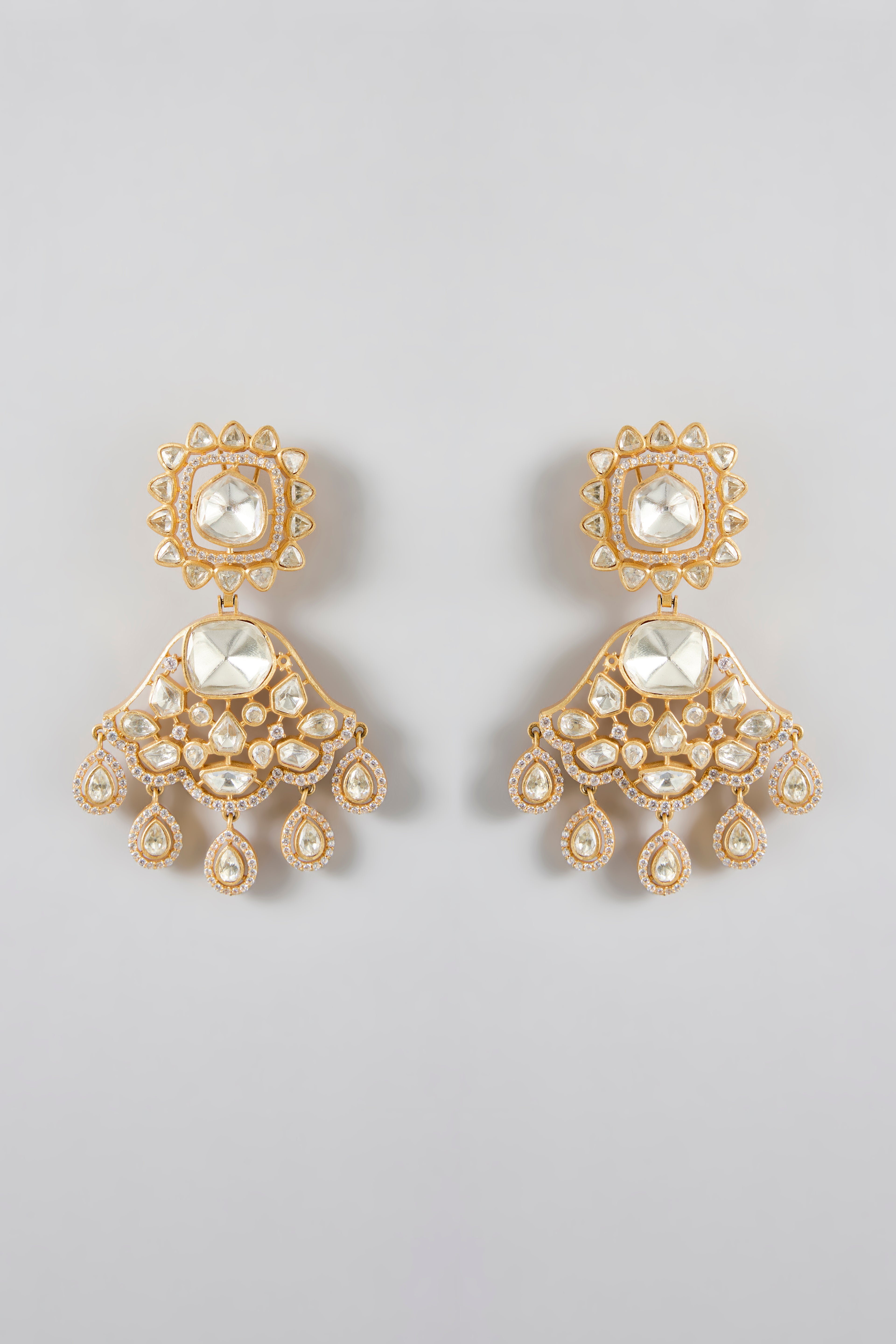 A classic silhouette elevated gold-plated danglers adorned